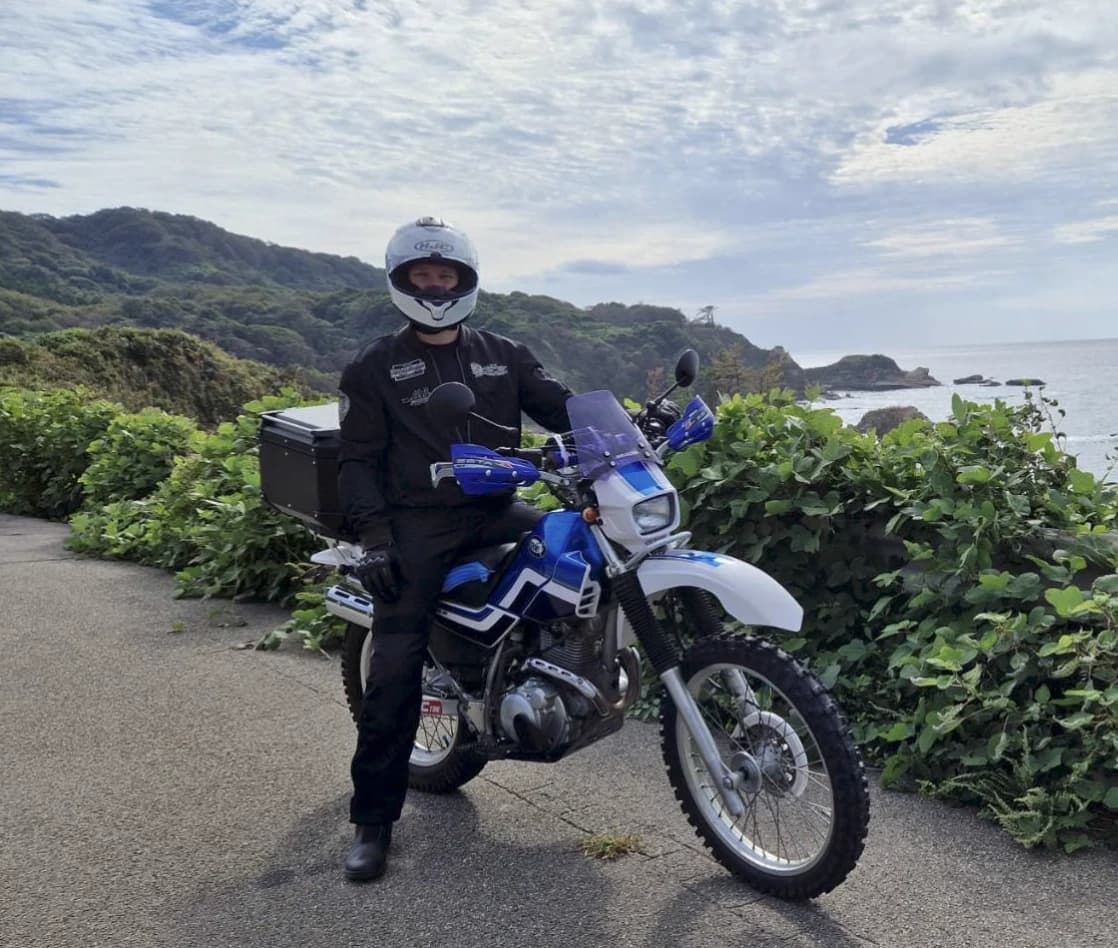 Stijn beside a motorcycle on the coast road of the Noto Peninsula